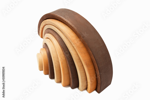 Wooden toy rainbow isolated on white.