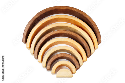 Wooden toy rainbow isolated on white.
