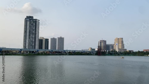 Scenic shot of a lake at Kolkata with beautiful building in the background. photo