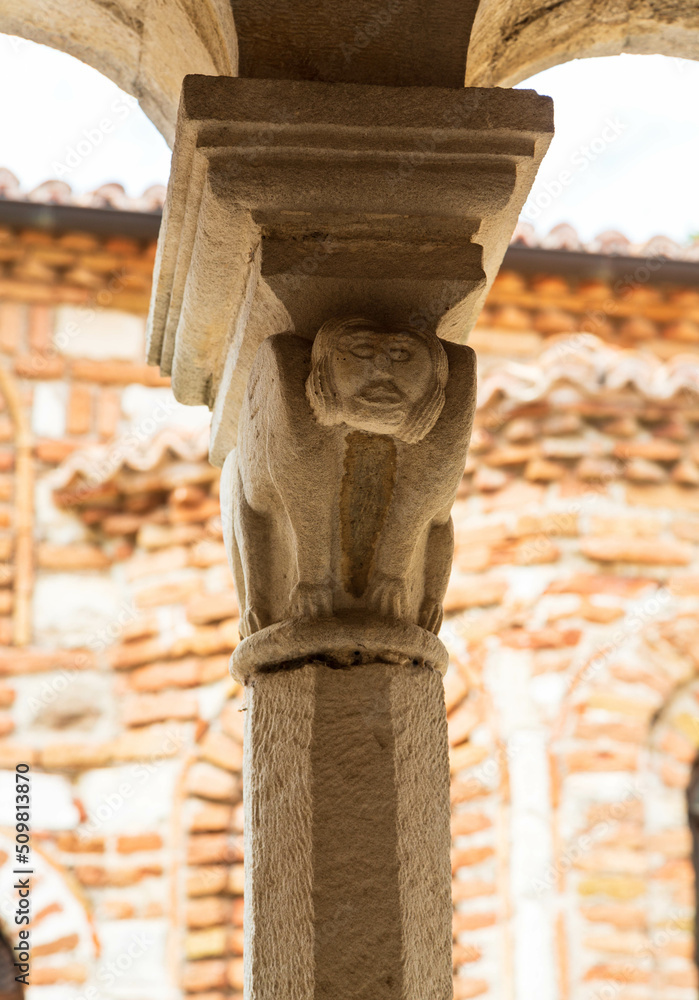 Apollonia, Albania - September, 2021: Close up of a carving of Jesus on the stone capital above a column at the Church of Saint Mary in Apollonia, Albania.