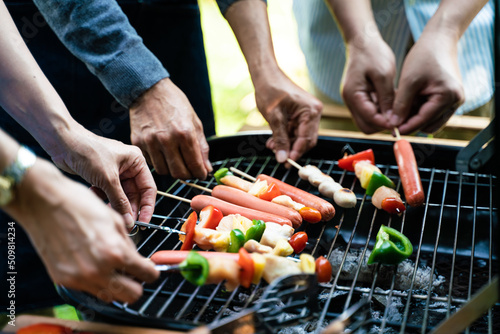 People hand grill BBQ in food party home garden