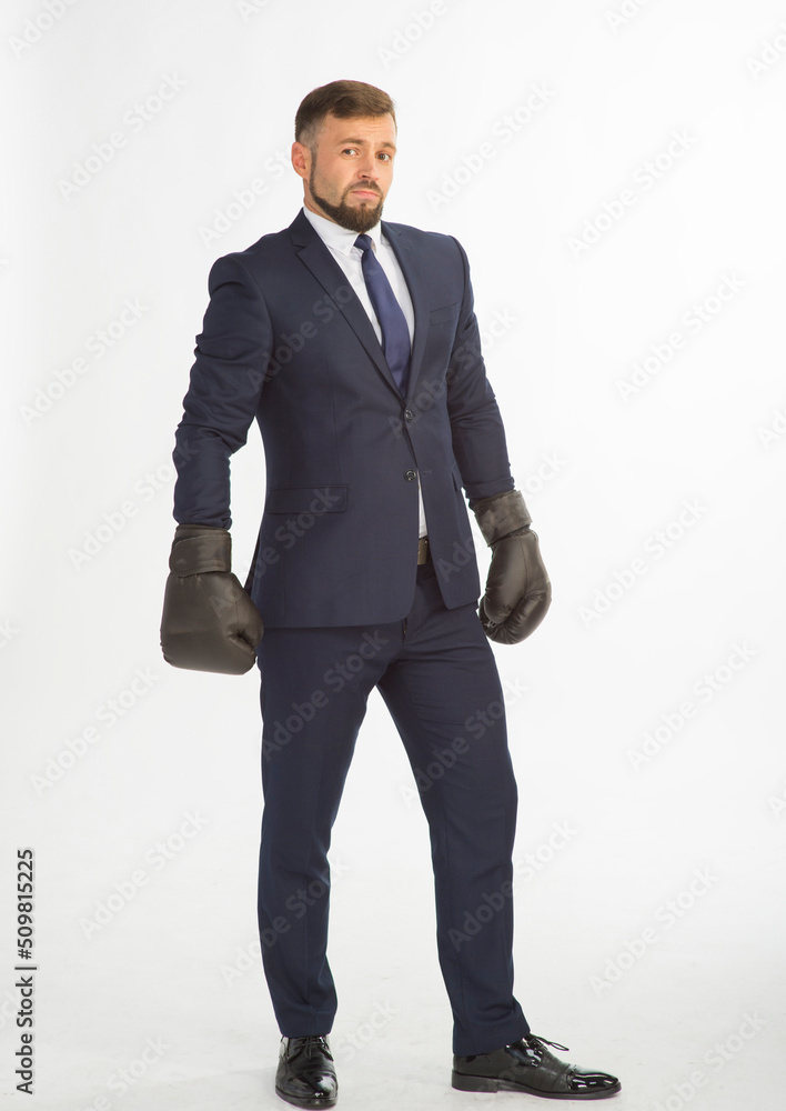 businessman in a business suit and boxing gloves posing on a white background isolated in full growth with a variety of emotions businessman in a business suit and boxing gloves posing on a white background isolated in full growth with a variety of emotions
