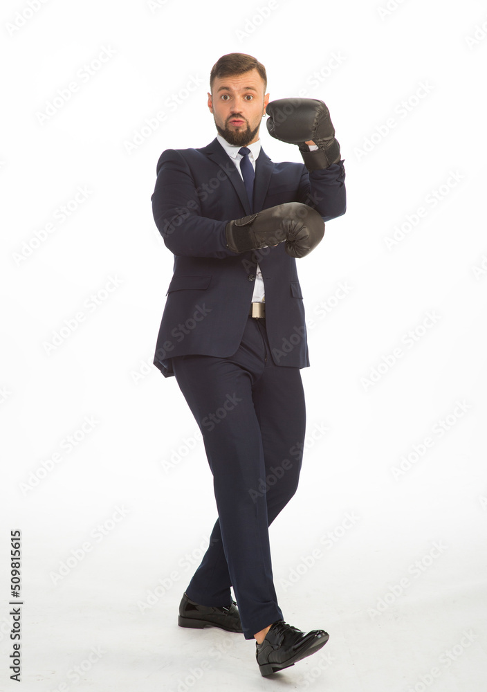 businessman in a business suit and boxing gloves posing on a white background isolated in full growth with a variety of emotions businessman in a business suit and boxing gloves posing on a white background isolated in full growth with a variety of emotions