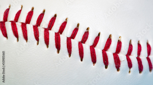 Close up macro of baseball stitch seam fibers and threads with a shallow depth of field and copy space