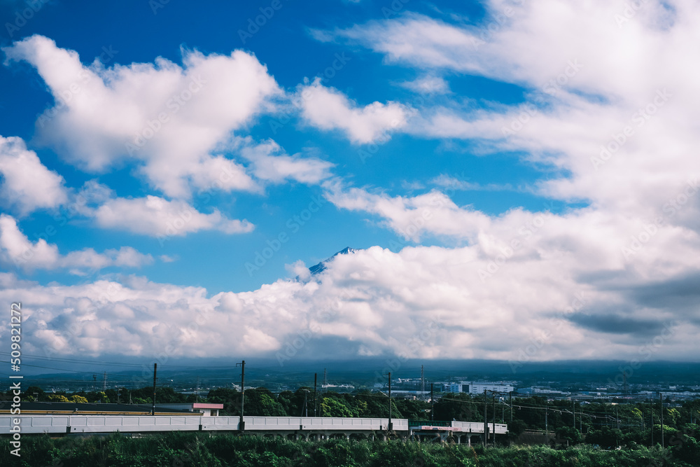 view of white clouds and blue sky covering mount fuji in summer in japanese village view of white clouds and blue sky covering mount fuji in summer in japanese village