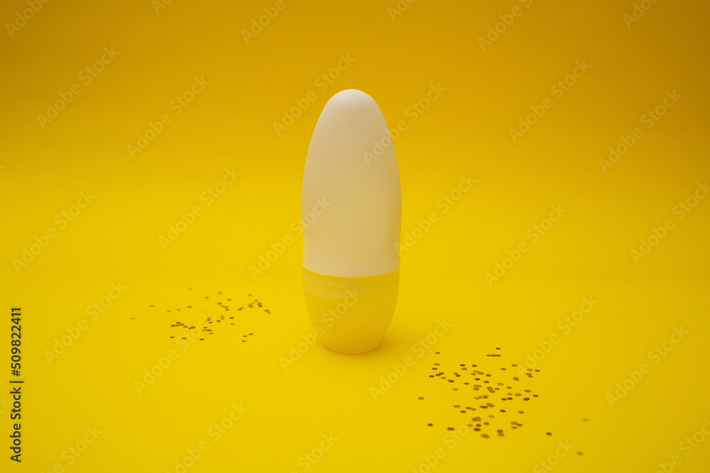 Deodorant stands on a yellow background Deodorant stands on a yellow background