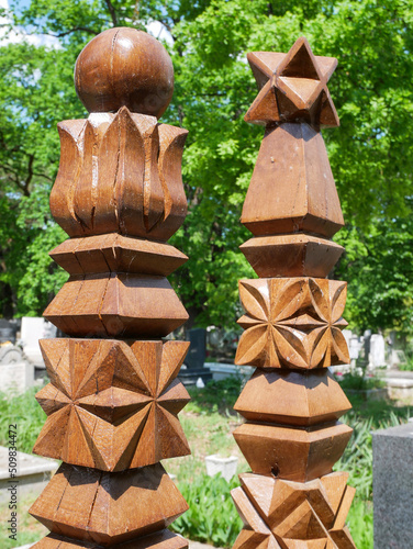 Wooden headstone in the public cemetery photo