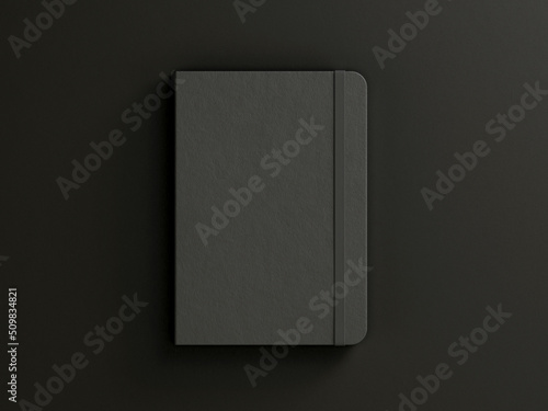 Black moleskine isolated on the black background