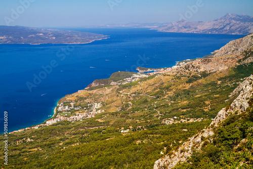 view from biokovo mountain to dalmatian coastline near baska voda, croatia photo