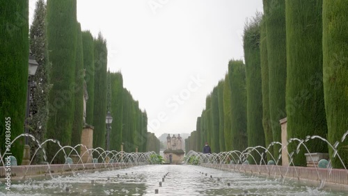 Castle of the Christian Monarchs Garden Fountain on Cloudy Day photo