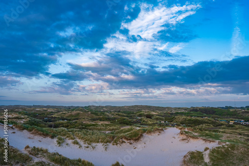 View of the dune landscape near Egmond aan Zee/Netherlands on a cloudy sky in the evening © fotografci