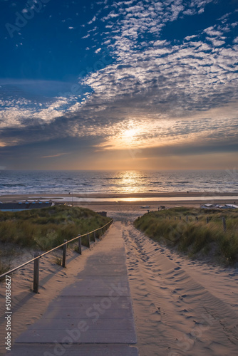 View of the North Sea at a beach entrance near Egmond aan Zee/Netherlands at sunset