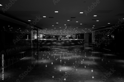 Print op canvas Mall, lights from the ceiling are reflecting on the shiny floor.