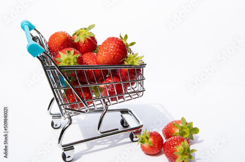 Strawberry fruit with strawberry leaf isolated on white background.