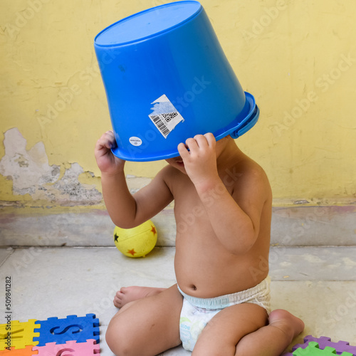 Cute little boy Shivaay at home balcony during summer time, Sweet little boy photoshoot during day light, Little boy enjoying at home during photo shoot photo