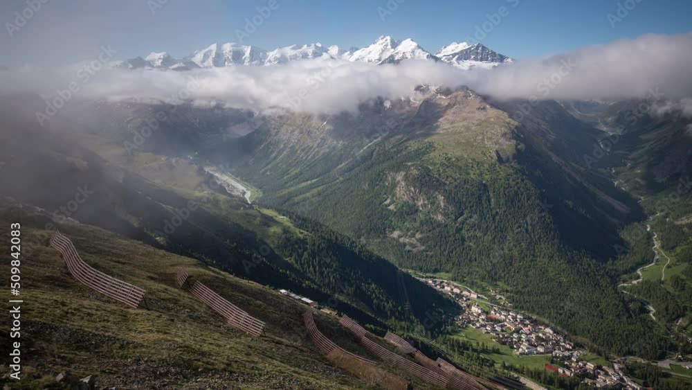timelapse at the edge of dissolving fog seen from Segantini Hut in direction of Bernina Massive with views of Pontresina, Piz Palü, Piz Bernina and Val Roseg timelapse at the edge of dissolving fog seen from Segantini Hut in direction of Bernina Massive with views of Pontresina, Piz Palü, Piz Bernina and Val Roseg