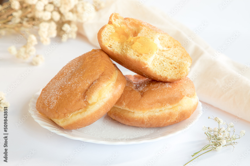 Bolas de Berlim, Berliner or donuts filled with egg jam, a very popular dessert in Portuguese pastry shops.
