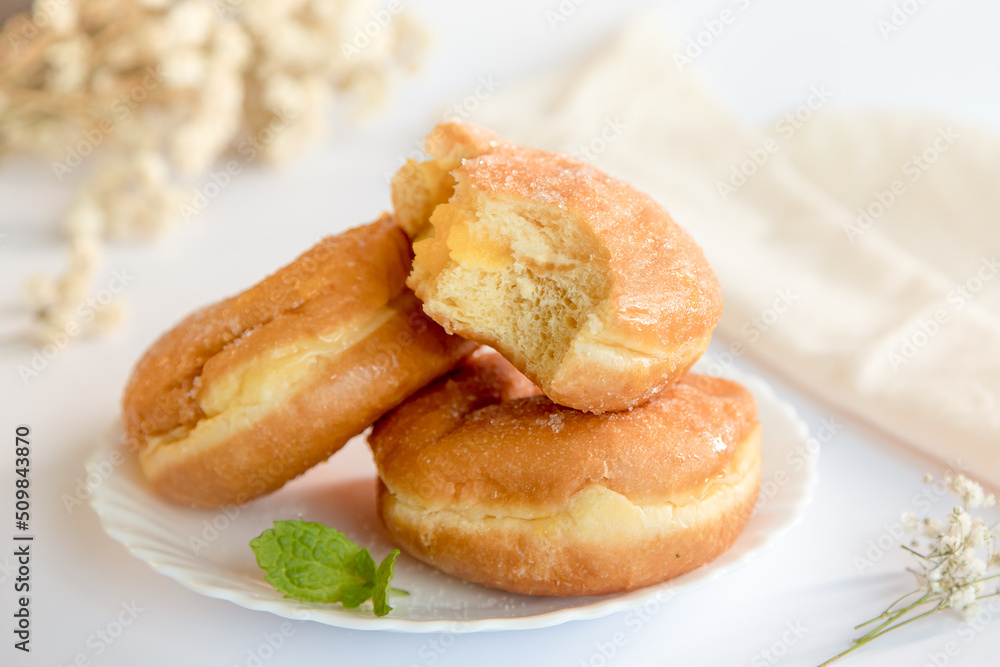 Bolas de Berlim, Berliner or donuts filled with egg jam, a very popular dessert in Portuguese pastry shops.