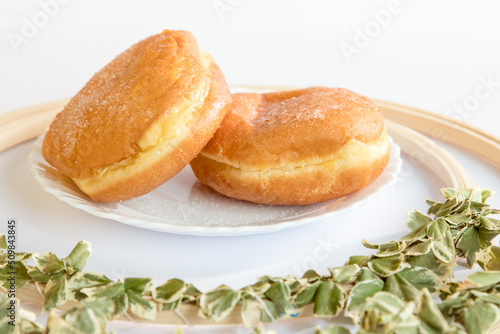 Bolas de Berlim, Berliner or donuts filled with egg jam, a very popular dessert in Portuguese pastry shops. photo