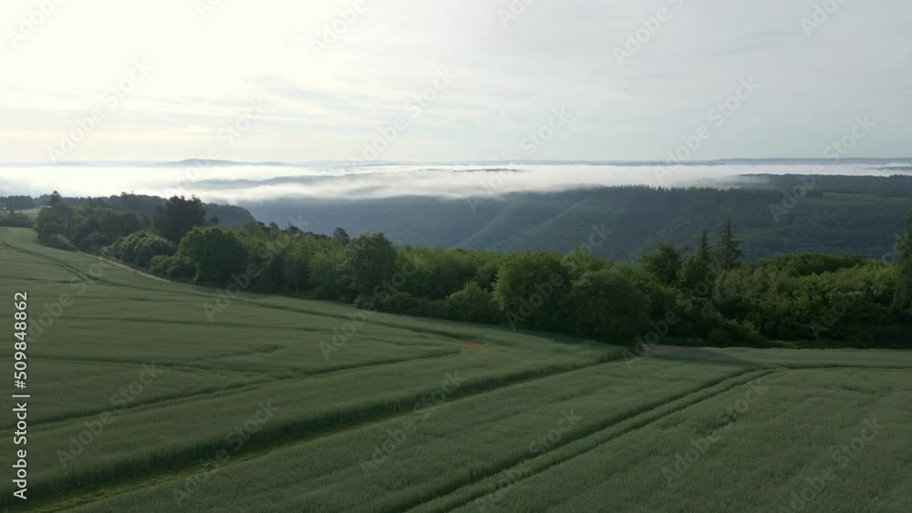 Steep Sw A steep and expansive river valley revealed behind lush, green farmland ...