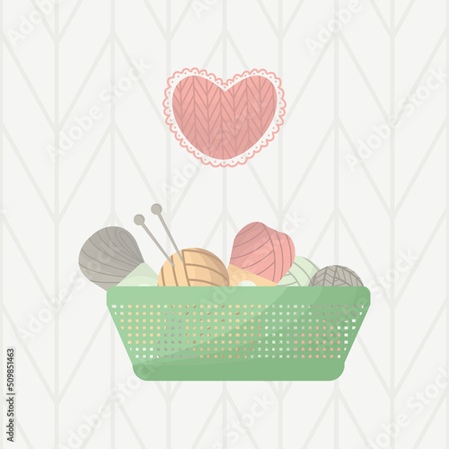 knitting with a box of yarn and a heart