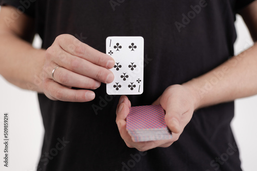 Male hands hold a deck of cards and show tricks.
The photographer is the author of the design of playing cards, which is written in the release of the property. photo