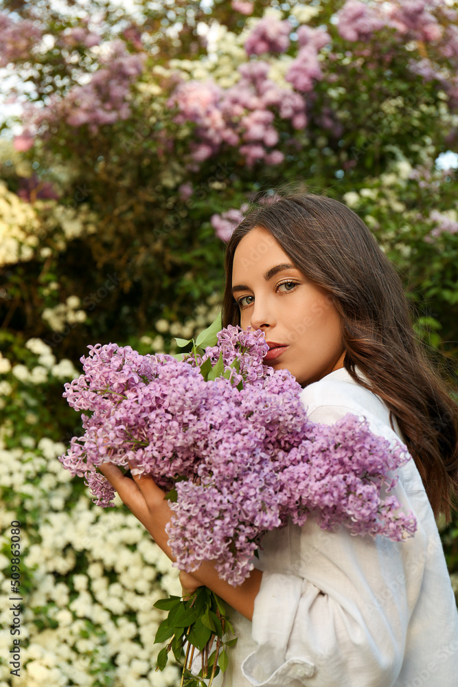 Attractive young woman with lilac flowers outdoors Attractive young woman with lilac flowers outdoors