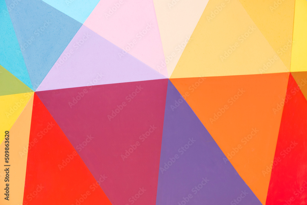 Brightly colored geometric background with color gradients and copy space - stock photo