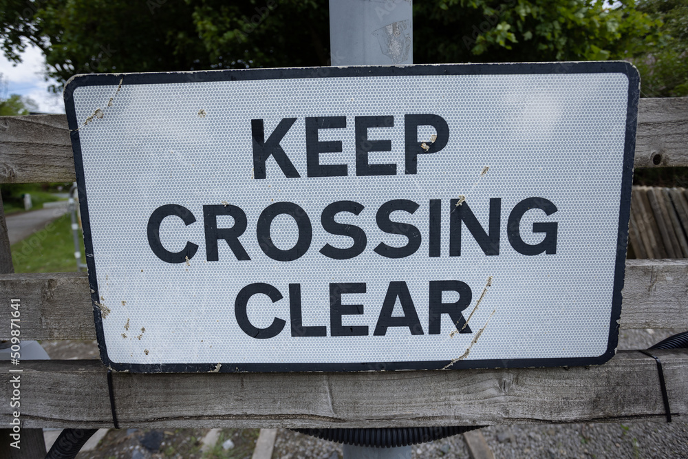 Keep crossing clear sign at Bolton Abbey railway station, Yorkshire, UK Keep crossing clear sign at Bolton Abbey railway station, Yorkshire, UK