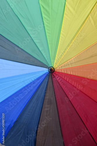 closeup the multicolored umbrella soft focus natural colorful background.