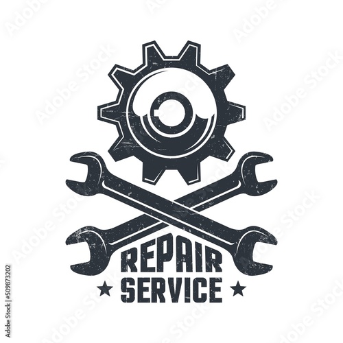 Mechanical repair workshop - retro logo with gear and wrenches. Spanner and gear wheel - vintage emblem.