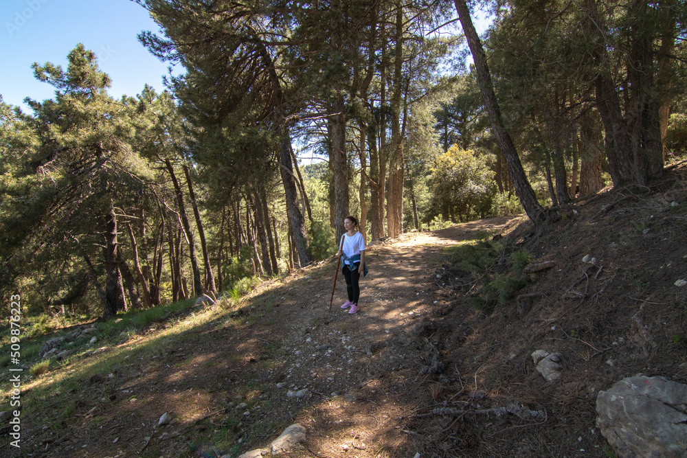 1A middle-aged Caucasian woman hiking in the Sierra de Cazorla. Concept of the lifestyle of middle-aged people.