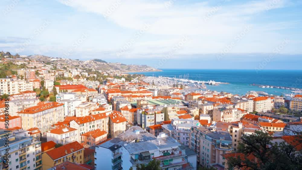 Cityscape of Sanremo from a view point, Italy. Residential buildings made in classic style, Mediterranean sea coast and sea port Cityscape of Sanremo from a view point, Italy. Residential buildings made in classic style, Mediterranean sea coast and sea port