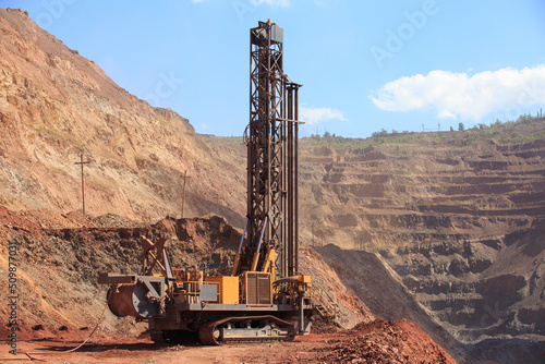 Machine for drilling wells in the quarry. Drilling of boreholes for laying an explosion in a quarry. Technologies of open-pit mining of minerals.