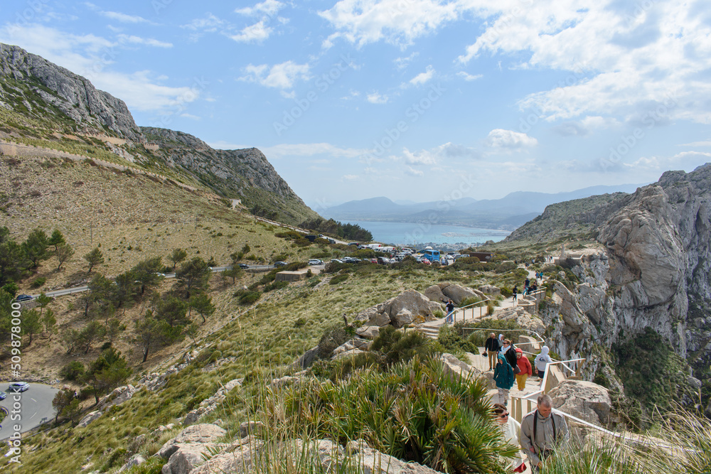 Obraz premium Mirador Es Colomer Formentor, Mallorca, Spain - 05.05.2022: Tourists walking at Mirador Es Colomer Formentor, Mallorca, Spain.