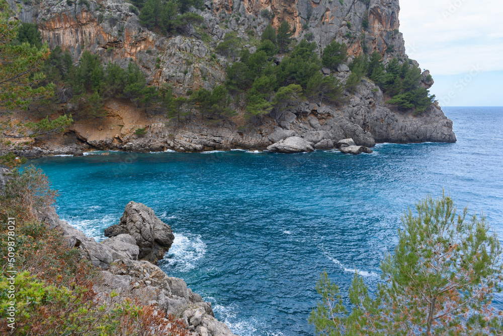 Turquoise sea water and cliffs in Sa Calobra, Mallorca, Spain