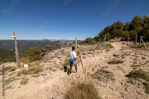 A middle-aged woman hiking the trails of the Sierra De Cazorla, Spain. Nature tourism concept.
