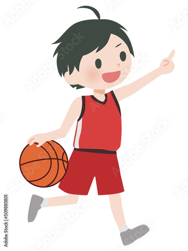 バスケットボールをする少年