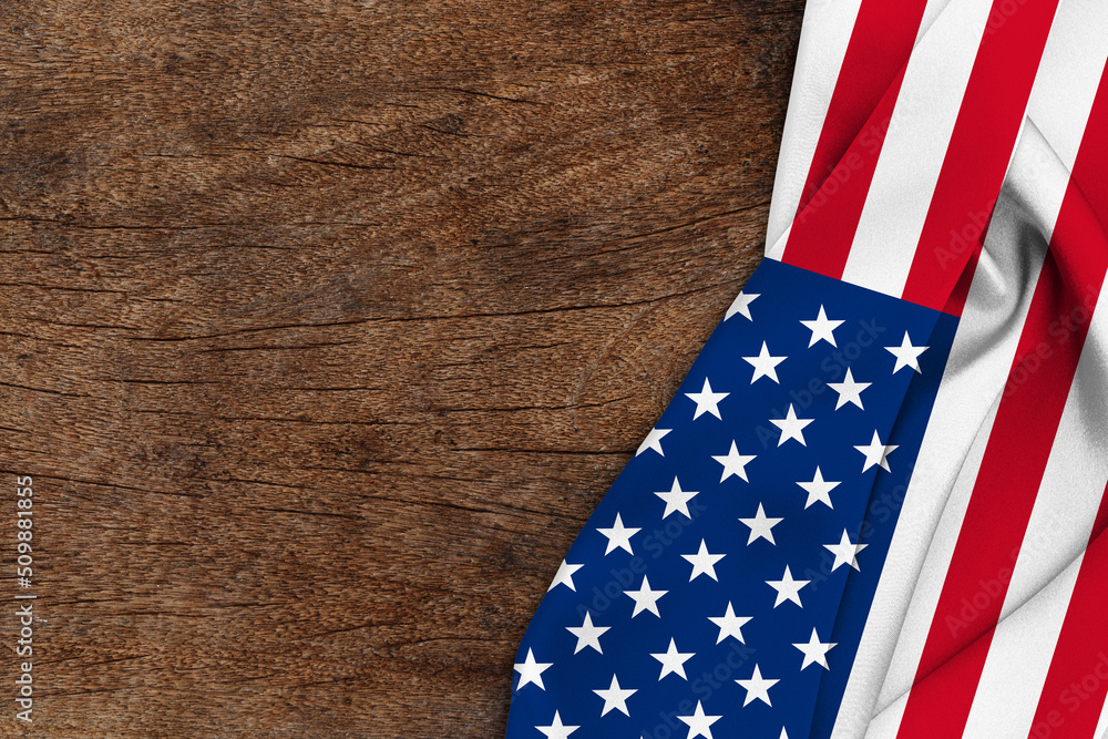 Fototapeta premium American flag wave on wood background