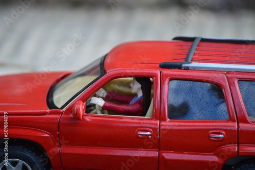miniature of girl driving a car