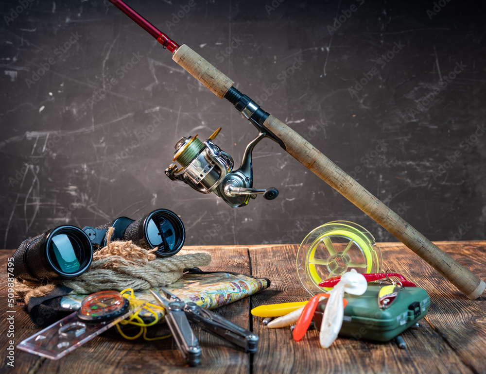 Spinning for catching a predator and bait. Binoculars, map and compass ...