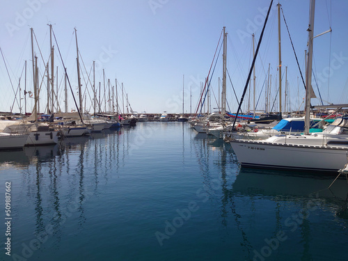 yachts in a marina in Gran Canaria, image shows a beautiful clear calm marina full of yachts on a clear summers day 