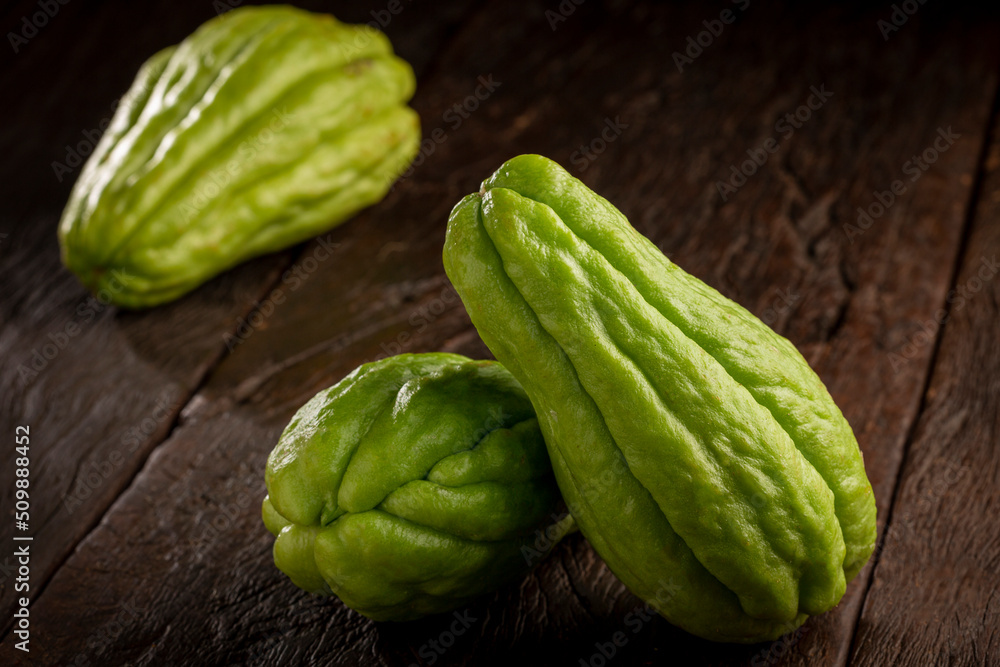 Fresh chayote fruits on the table. Fresh chayote fruits on the table.