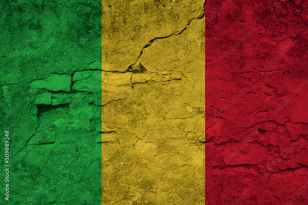 Patriotic cracked wall background in colors of national flag. Mali
