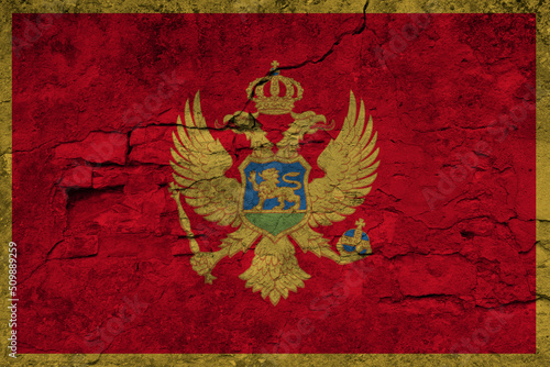 Patriotic cracked wall background in colors of national flag. Montenegro