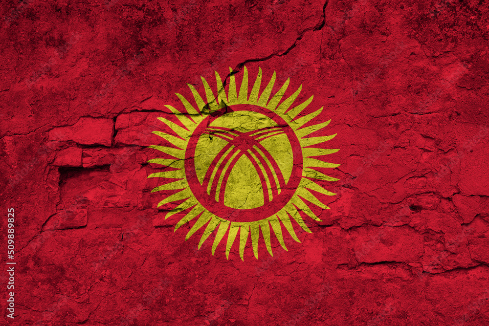 Patriotic cracked wall background in colors of national flag. Kyrgyzstan