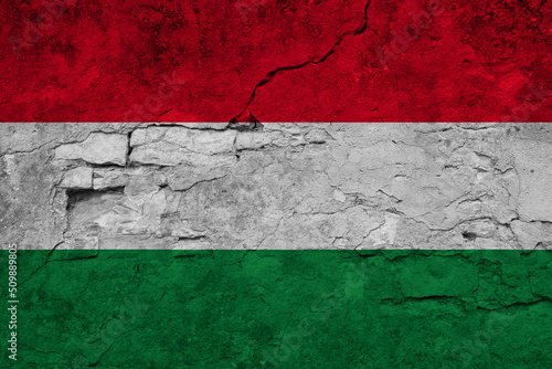 Patriotic cracked wall background in colors of national flag. Hungary