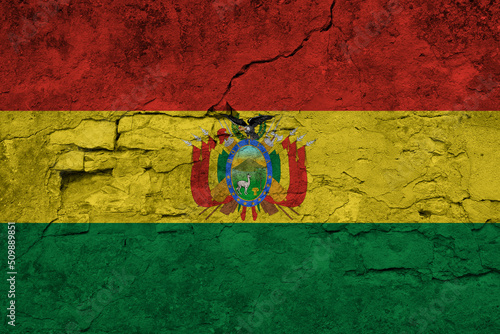 Patriotic cracked wall background in colors of national flag. Bolivia