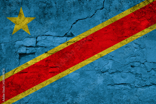Patriotic cracked wall background in colors of national flag. Democratic Republic of the Congo