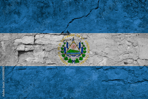 Patriotic cracked wall background in colors of national flag. El Salvador
